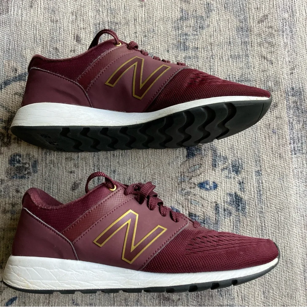 New Balance women’s Burgundy Sneakers with Gold Accent